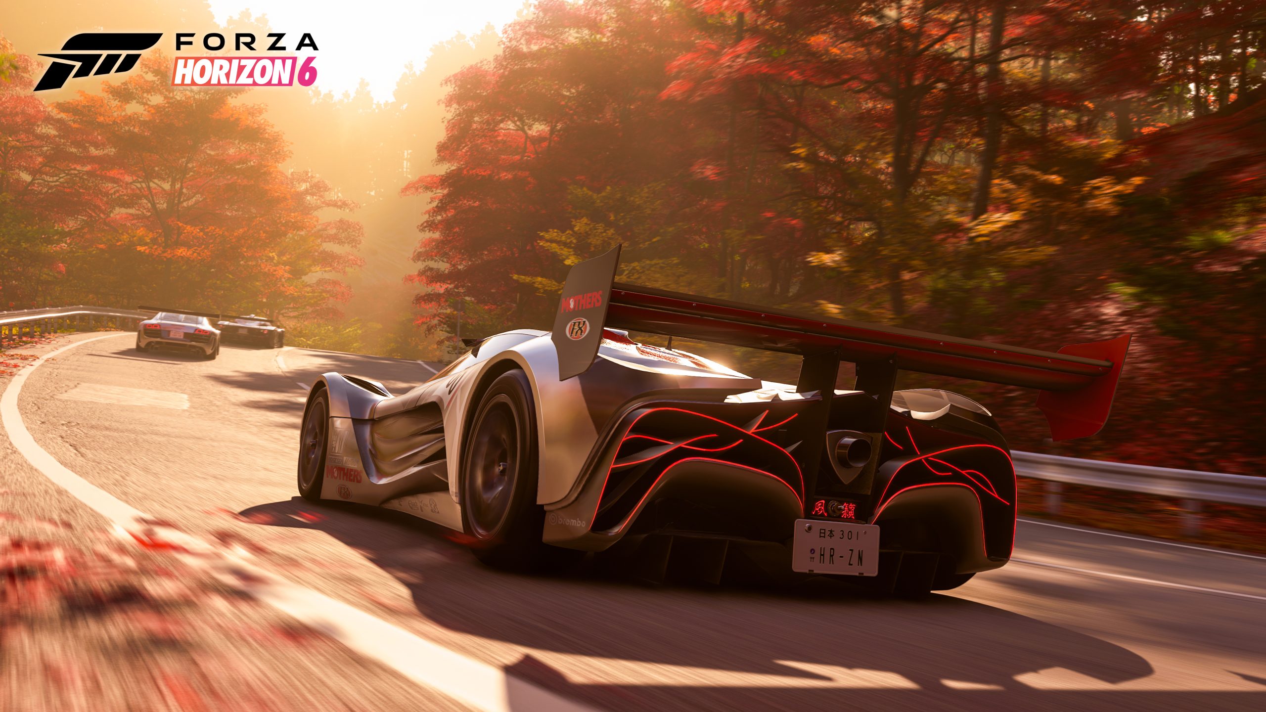 Voiture de sport sur une route bordée d'arbres aux couleurs automnales dans Forza Horizon 6, capture officielle PlayStation 5